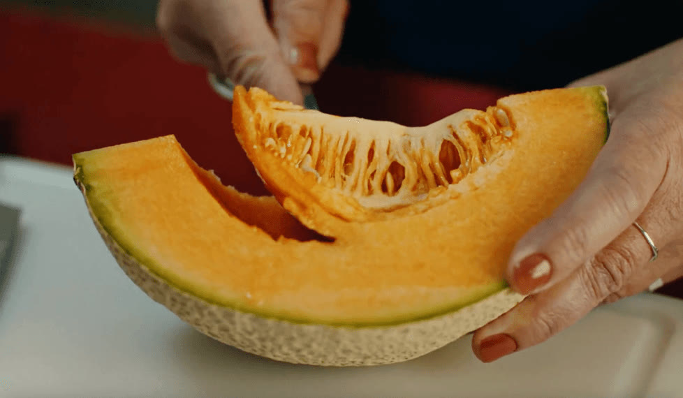 A cantaloupe, cut and shared after the game