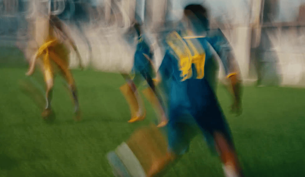 Players in the SS26 kits on the pitch, motion blurred